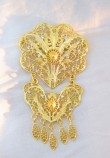 GOLD BROOCH IN OCTAGON