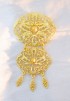 GOLD BROOCH IN OVAL